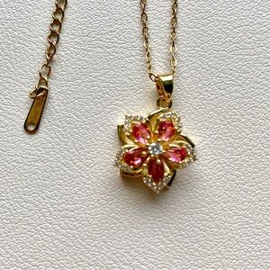 flower pendant with red accents